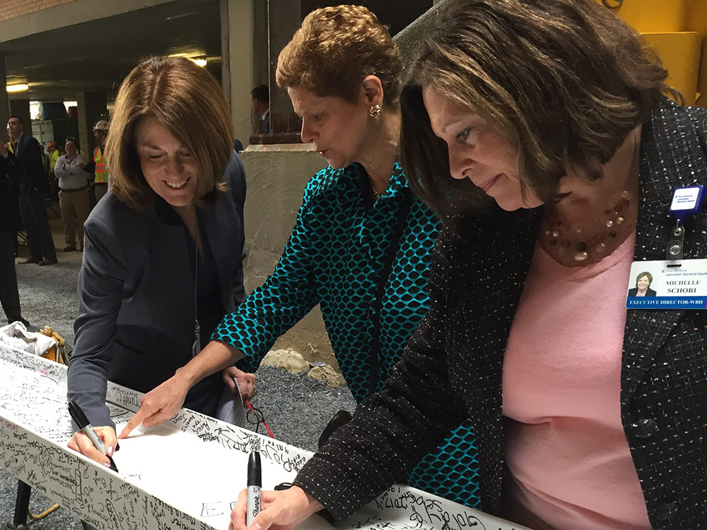 Representatives signging a beam for the Lancaster General Health Frederick Building construction