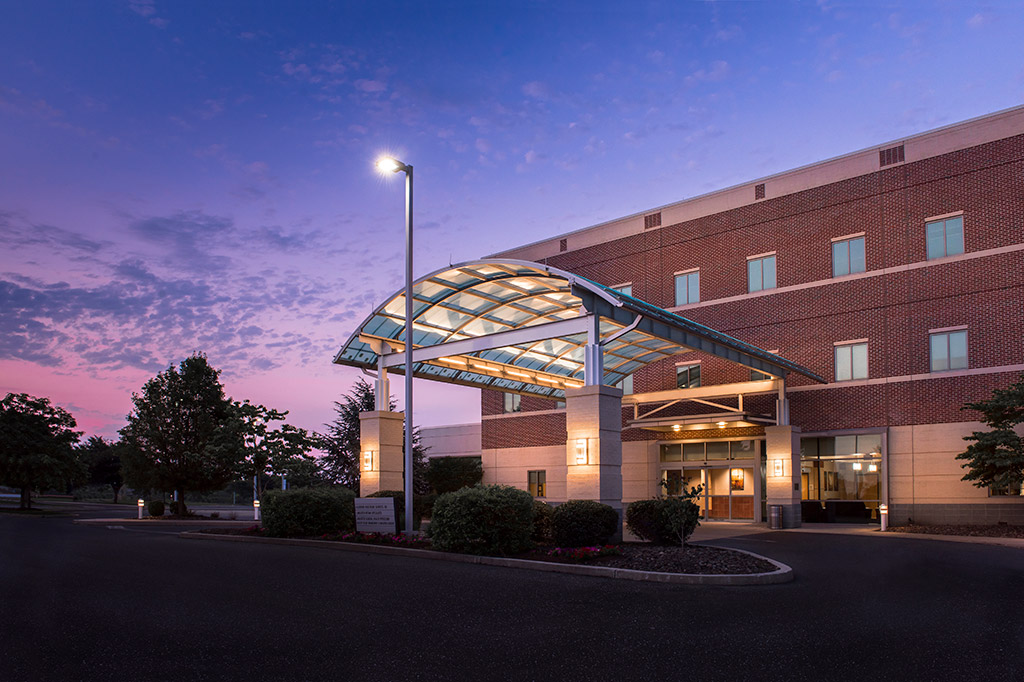 A view of the front entrance to the Neroscience Institute at twilight